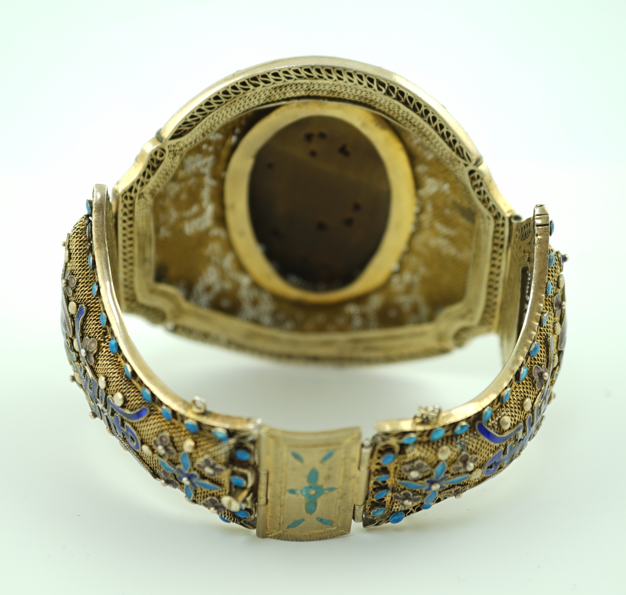 A Chinese silver-gilt, enamel and tiger's-eye bracelet, early 20th century